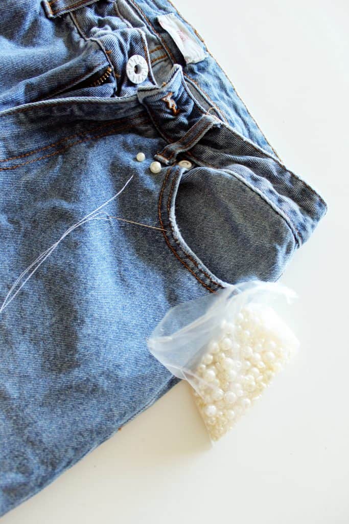 Add Pearl Beads To Your Old Jeans for a new look . Denim refashion idea